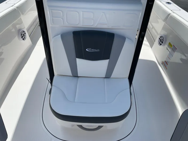 Slide: The Image of 2025 Robalo R230 Center Console boat seat, white and gray design. - 14