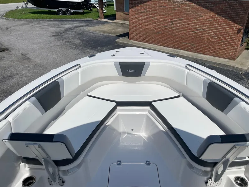 Slide: The Image of 2025 Robalo R230 Center Console boat with spacious seating and sleek design. - 18