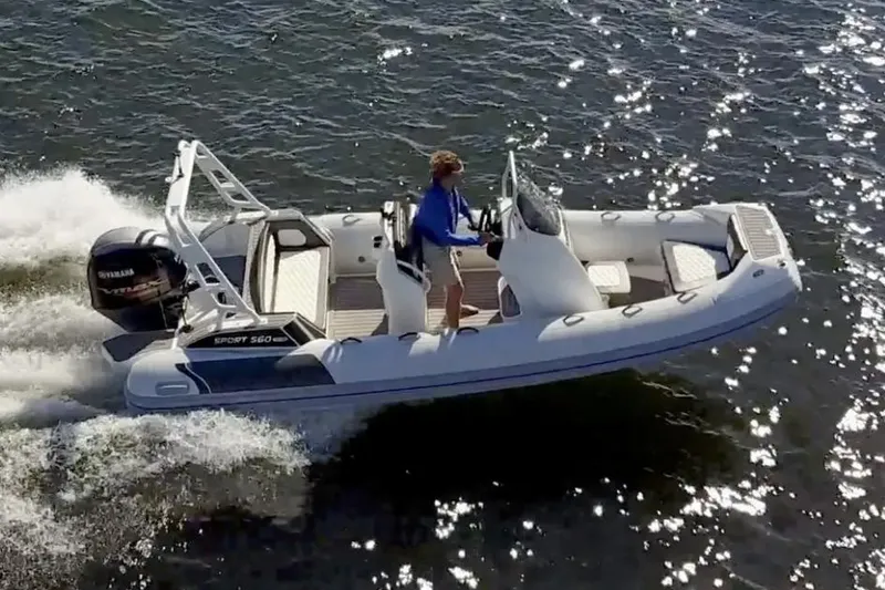 Slide: The Image of 2025 Highfield Sport 560 boat cruising on water with Yamaha engine. - 3