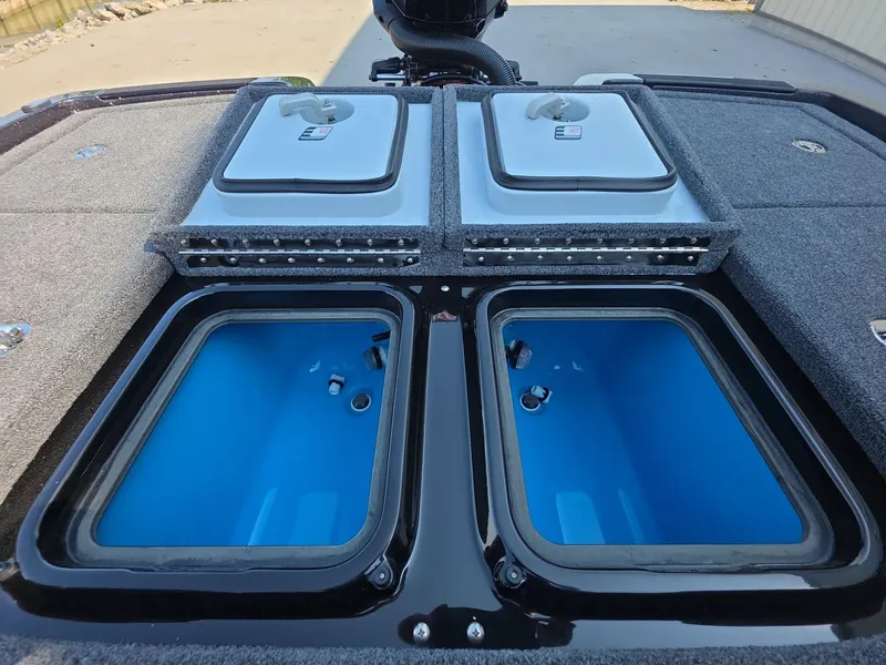 Slide: The Image of 2026 iKon LX21 boat with dual livewells and storage compartments, featuring a sleek design. - 14