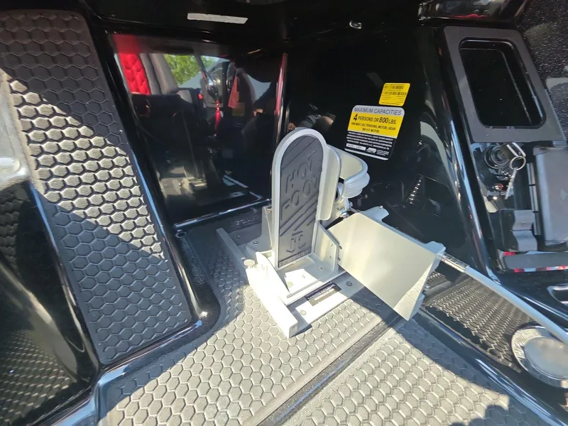 Slide: The Image of Interior of iKon LX21 boat, featuring hexagonal flooring and a foldable seat, 2026 model. - 18