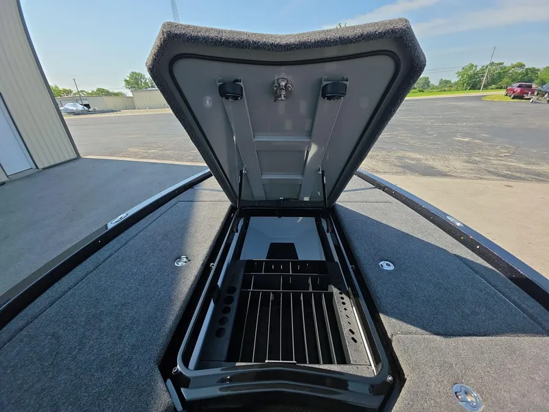 Slide: The Image of Open storage compartment on 2026 iKon LX21 boat, showcasing interior design and organization. - 19