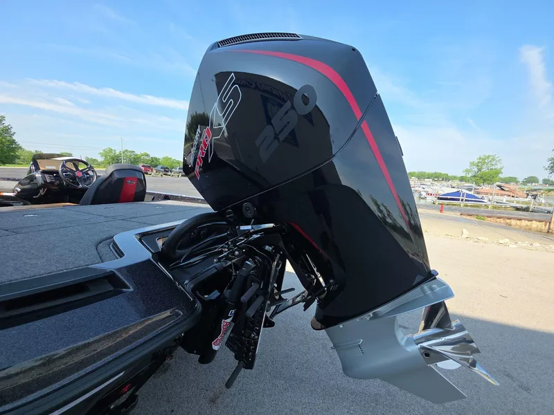 Slide: The Image of iKon LX21 2026 boat with powerful 250 horsepower outboard motor, parked outdoors. - 6