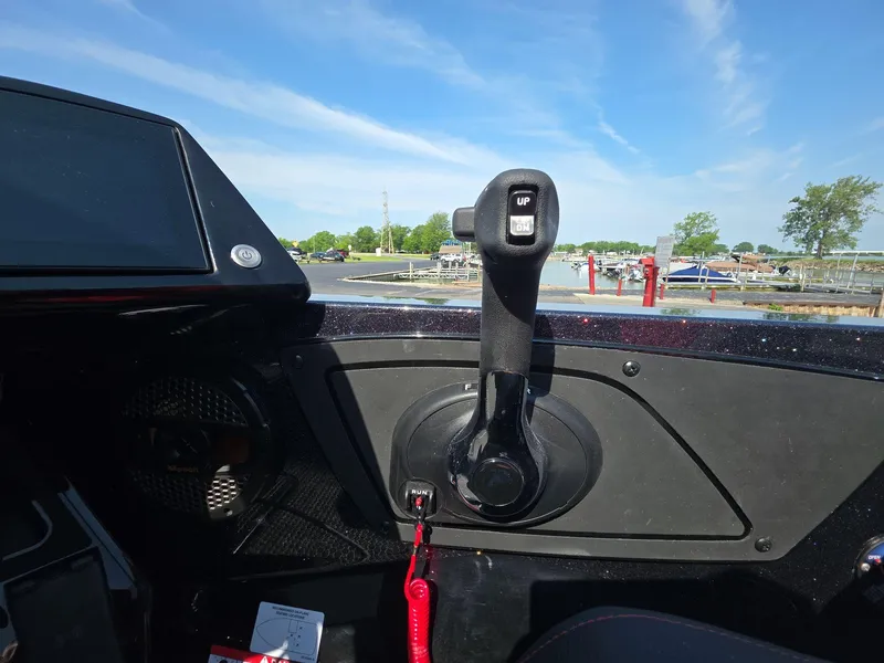 Slide: The Image of Control panel of 2026 iKon LX21 boat with throttle lever and display screen. - 7