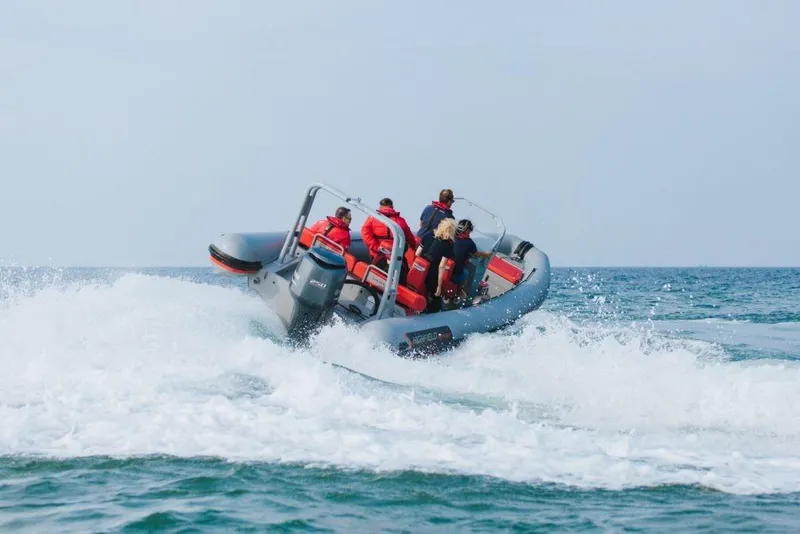 Slide: The Image of 2024 Highfield Patrol 760 navigating waves with passengers on board. - 2