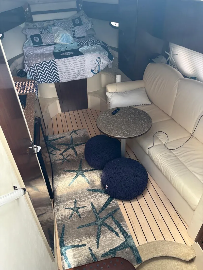 Slide: The Image of Interior of 2013 Cruisers Yachts 350 Express with cozy seating and nautical decor. - 11