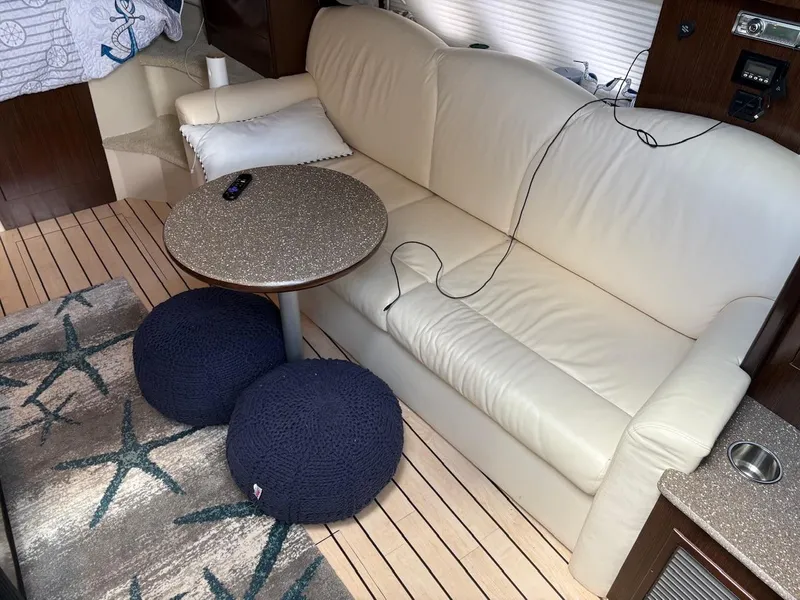 Slide: The Image of Luxurious interior of 2013 Cruisers Yachts 350 Express with cream sofa and modern decor. - 10