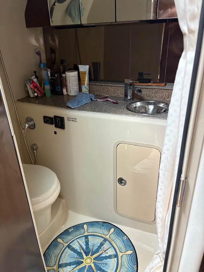 Slide: The Image of Bathroom interior of 2013 Cruisers Yachts 350 Express with nautical-themed decor. - 6