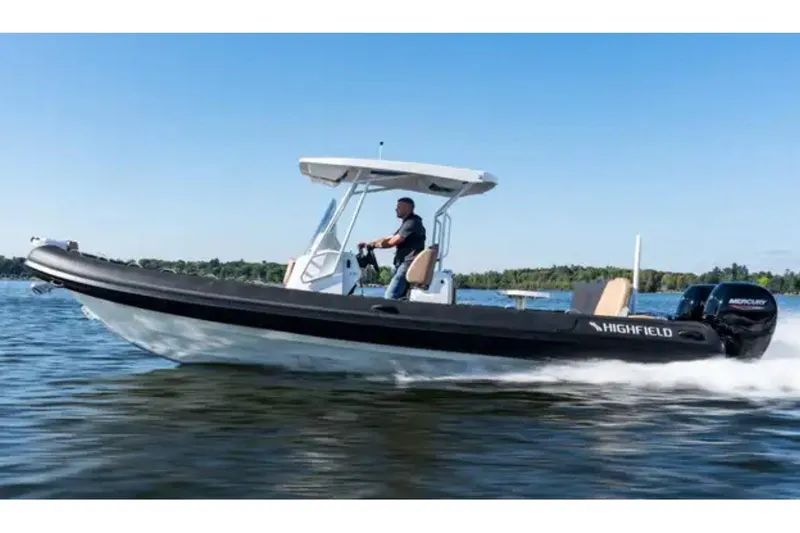 The Image of 2024 Highfield Sport 800 boat cruising on a lake with a driver. - 0