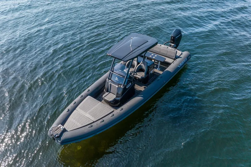 Slide: The Image of 2026 Highfield Sport 900 boat on calm water. - 6