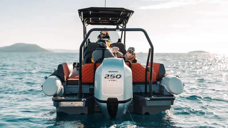 Slide: The Image of 2025 Highfield ADV7 boat with Honda 250 VTEC engine on open water. - 1