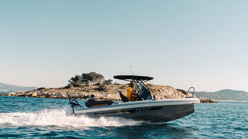 Slide: The Image of 2025 Highfield ADV7 boat cruising near an island on a sunny day. - 7