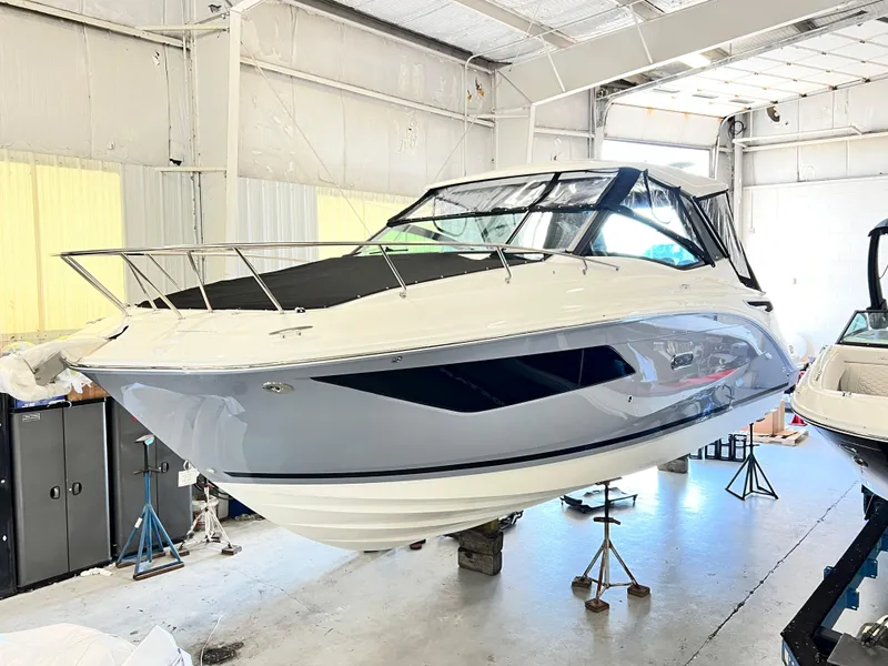 The Image of 2025 Sea Ray Sundancer 320 yacht in a boatyard, showcasing sleek design and modern features. - 0