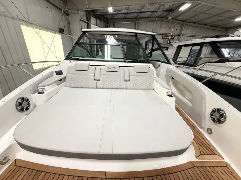 Slide: The Image of 2025 Sea Ray Sundancer 320 boat interior with spacious seating and modern design. - 6