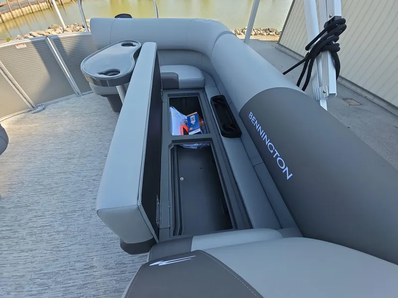 Slide: The Image of 2025 Bennington 20 SL pontoon boat interior with storage compartments open. - 13