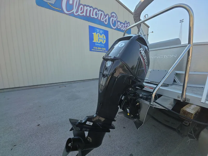 Slide: The Image of 2025 Bennington 20 SL boat with Mercury outboard motor at Clemons Boats dealership. - 5
