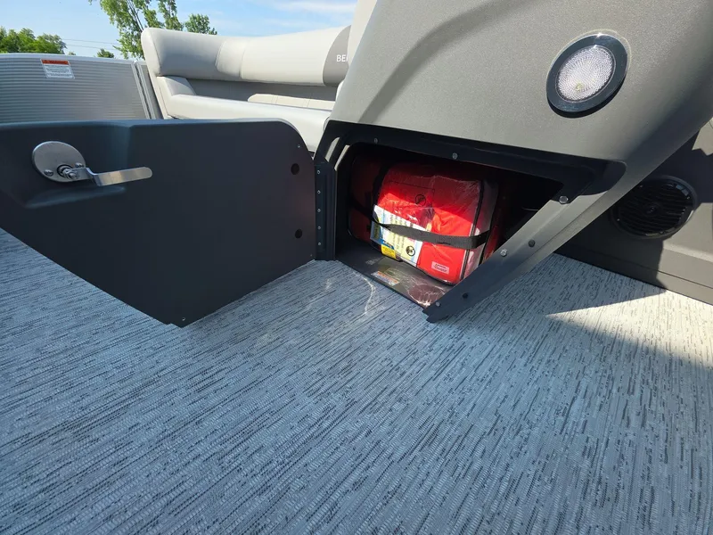 Slide: The Image of 2025 Bennington 20 SL boat storage compartment with safety equipment. - 8