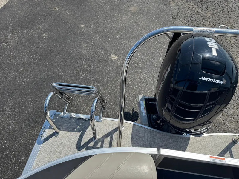 Slide: The Image of 2023 South Bay 224RS LE Tritoon with Mercury 150 engine and stainless steel ladder. - 15