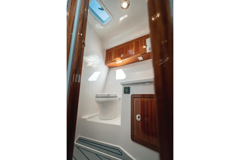 Slide: The Image of Luxurious bathroom interior of 2027 Lindell 38' yacht with wooden cabinetry and modern fixtures. - 13