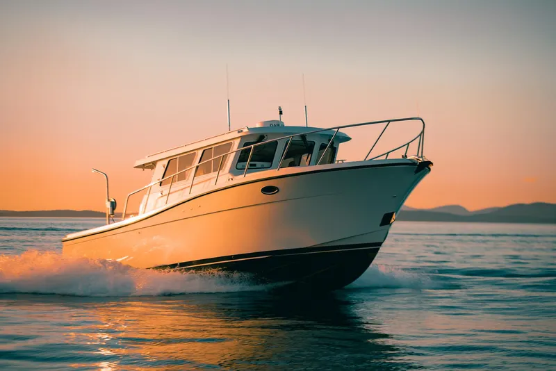 Slide: The Image of 2025 Lindell 38' boat docked with triple Yamaha outboard engines. - 2