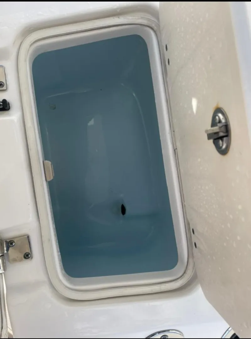 Slide: The Image of Open storage compartment on a 2018 Robalo 206 Cayman boat. - 7