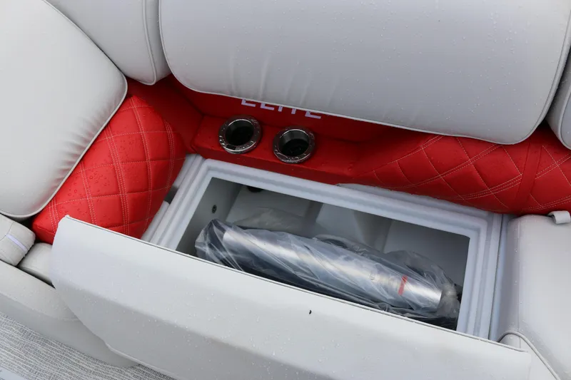 Slide: The Image of 2025 SunCatcher Elite 324 RC boat seat with red quilted upholstery and built-in storage compartment. - 14