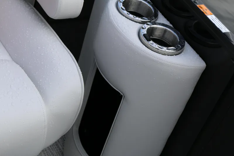 Slide: The Image of White leather seat with cup holders on a 2025 SunCatcher Elite 324 RC boat. - 16
