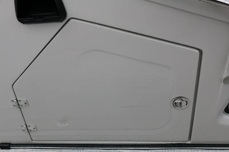 Slide: The Image of Compartment door of 2025 SunCatcher Elite 324 RC boat, featuring sleek design and secure latch. - 21