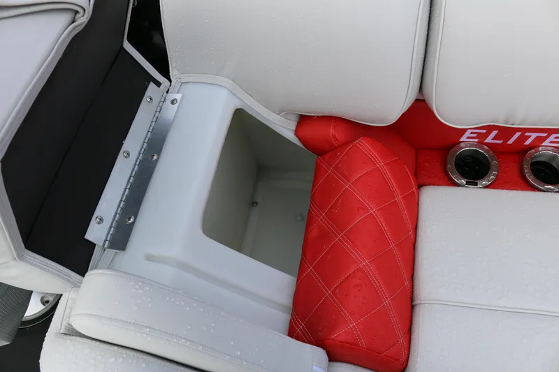 Slide: The Image of Interior of 2025 SunCatcher Elite 324 RC boat with storage compartment and red cushioned seating. - 23
