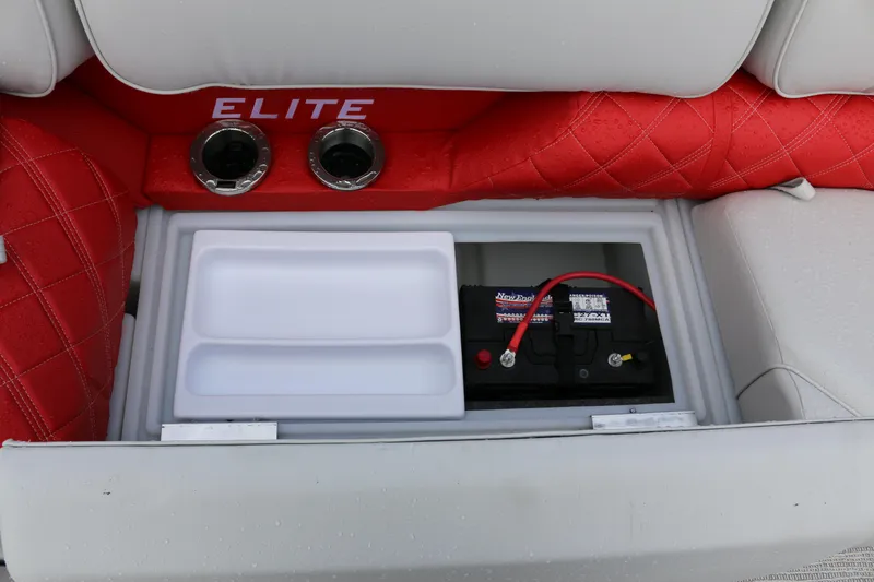 Slide: The Image of SunCatcher Elite 324 RC 2025 boat seat storage with battery and cup holders. - 24