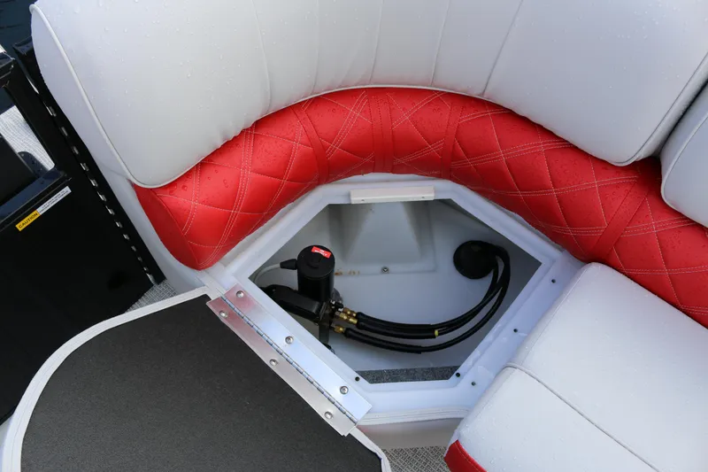 Slide: The Image of 2025 SunCatcher Elite 324 RC boat seat storage with red and white upholstery. - 30