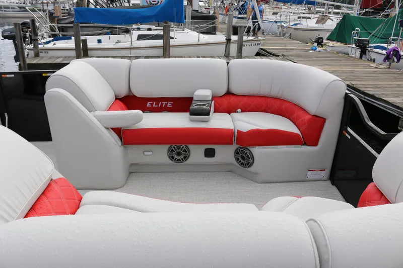 Slide: The Image of Luxurious seating on 2025 SunCatcher Elite 324 RC boat, featuring red and white upholstery. - 33