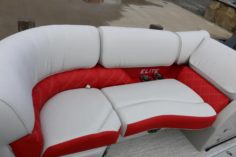 Slide: The Image of Luxurious seating on 2025 SunCatcher Elite 324 RC boat, featuring red and white upholstery. - 8