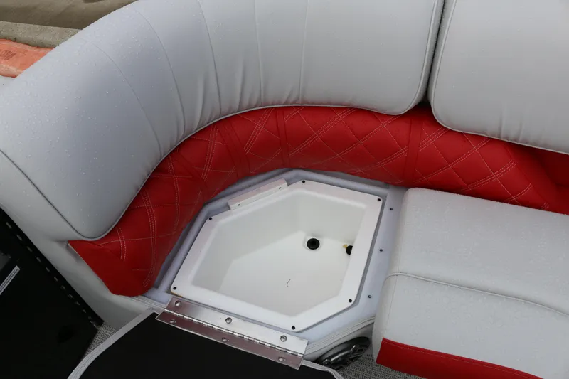 Slide: The Image of 2025 SunCatcher Elite 324 RC boat seating with red and gray upholstery, featuring storage compartment. - 9