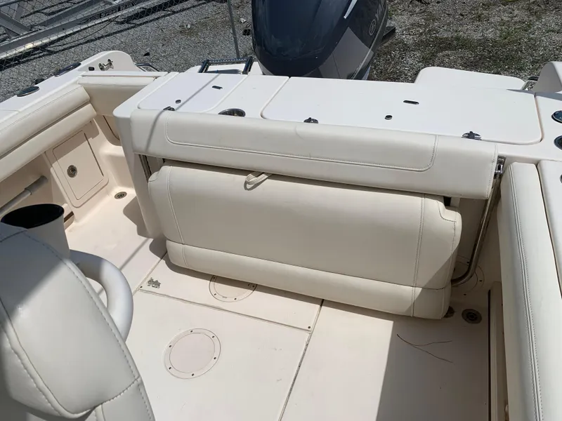 Slide: The Image of 2020 Grady-White 236 Fisherman boat interior with white seating and storage compartments. - 10