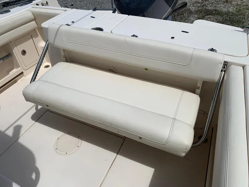 Slide: The Image of 2020 Grady-White 236 Fisherman boat with white cushioned seating and stainless steel supports. - 11