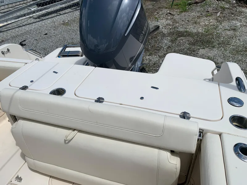 Slide: The Image of 2020 Grady-White 236 Fisherman boat with Yamaha outboard motor, rear seating, and storage compartments. - 12