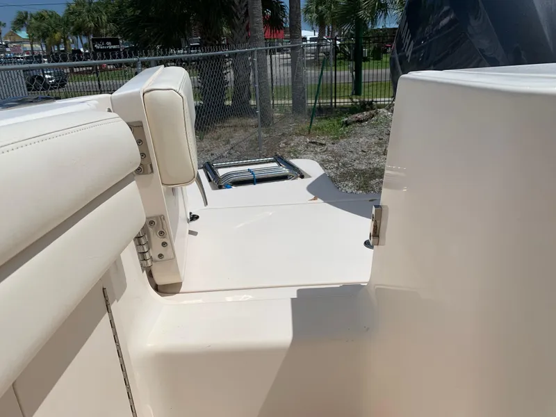 Slide: The Image of 2020 Grady-White 236 Fisherman boat interior with seating and ladder, outdoors. - 17