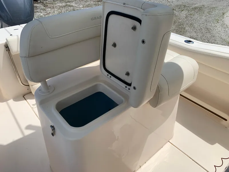 Slide: The Image of 2020 Grady-White 236 Fisherman boat seat with storage compartment open. - 21