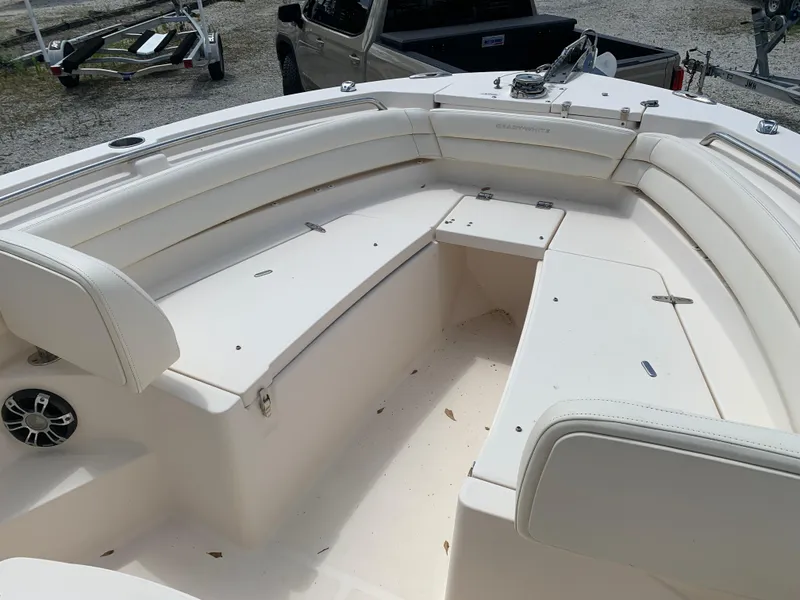 Slide: The Image of 2020 Grady-White 236 Fisherman boat interior with white seating and storage compartments. - 28