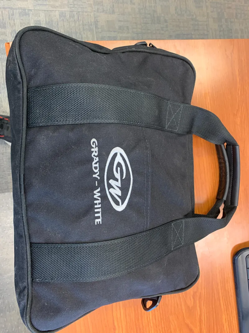 Slide: The Image of Black Grady-White branded bag on wooden table, 2020 model. - 41