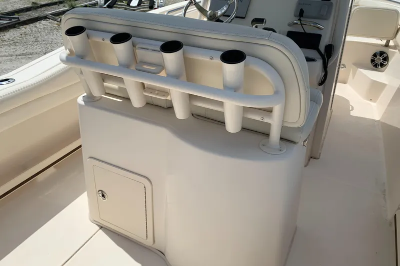 Slide: The Image of 2020 Grady-White 236 Fisherman boat interior with rod holders and storage compartment. - 43