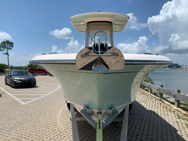 Slide: The Image of 2020 Grady-White 236 Fisherman boat on trailer by waterfront parking area. - 6