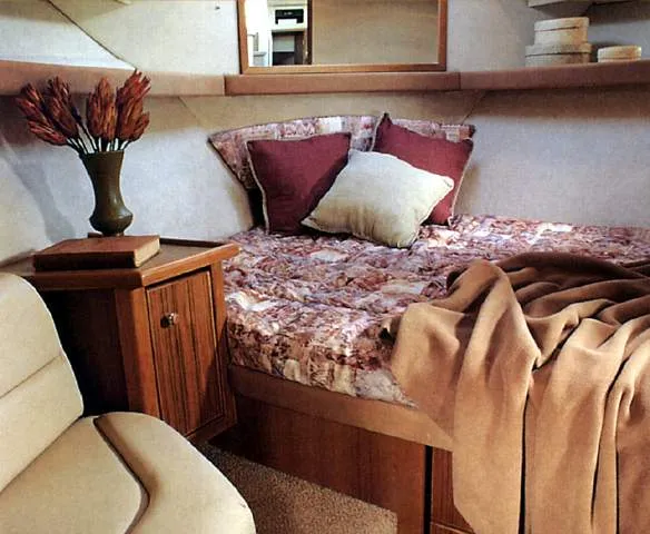 Slide: The Image of Cozy cabin interior of 1996 Bayliner 4087 Aft Cabin Motoryacht with bed and wooden furnishings. - 16