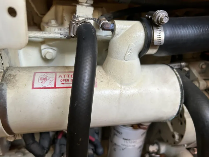 Slide: The Image of Engine compartment of 1996 Bayliner 4087 Aft Cabin Motoryacht, showing hoses and fittings. - 23