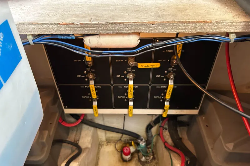 Slide: The Image of Electrical panel of a 1996 Bayliner 4087 Aft Cabin Motoryacht with labeled switches and wiring. - 26