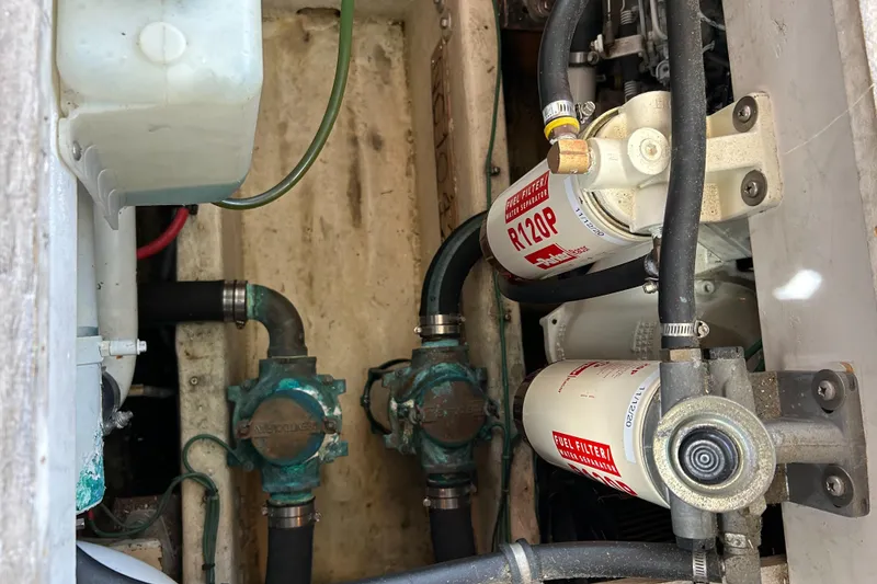 Slide: The Image of Engine compartment of 1996 Bayliner 4087 Aft Cabin Motoryacht with fuel filters and hoses. - 28
