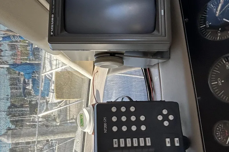 Slide: The Image of 1996 Bayliner 4087 Aft Cabin Motoryacht dashboard with navigation equipment and gauges. - 29