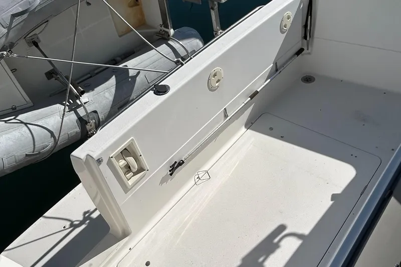 Slide: The Image of 1996 Bayliner 4087 Aft Cabin Motoryacht deck area with seating and storage. - 5