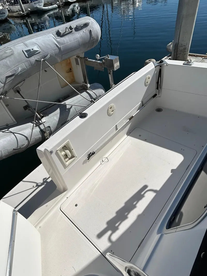 Slide: The Image of 1996 Bayliner 4087 Aft Cabin Motoryacht deck with docked inflatable boat. - 6